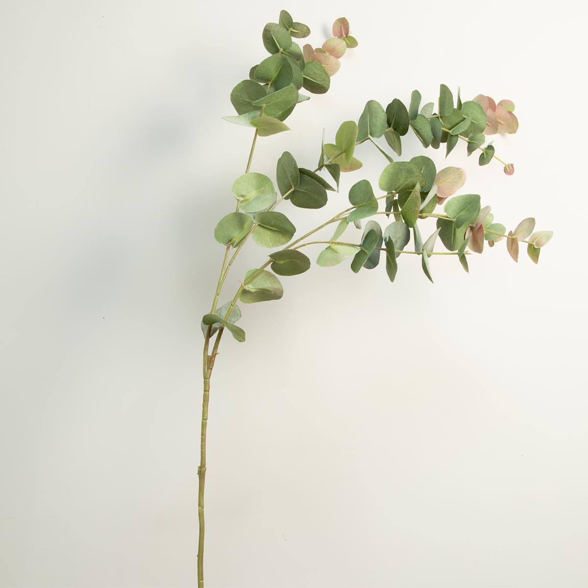 Artificial Eucalyptus Tall Spray with pink and green leaves - artificial leaves on a neutral background on a white background