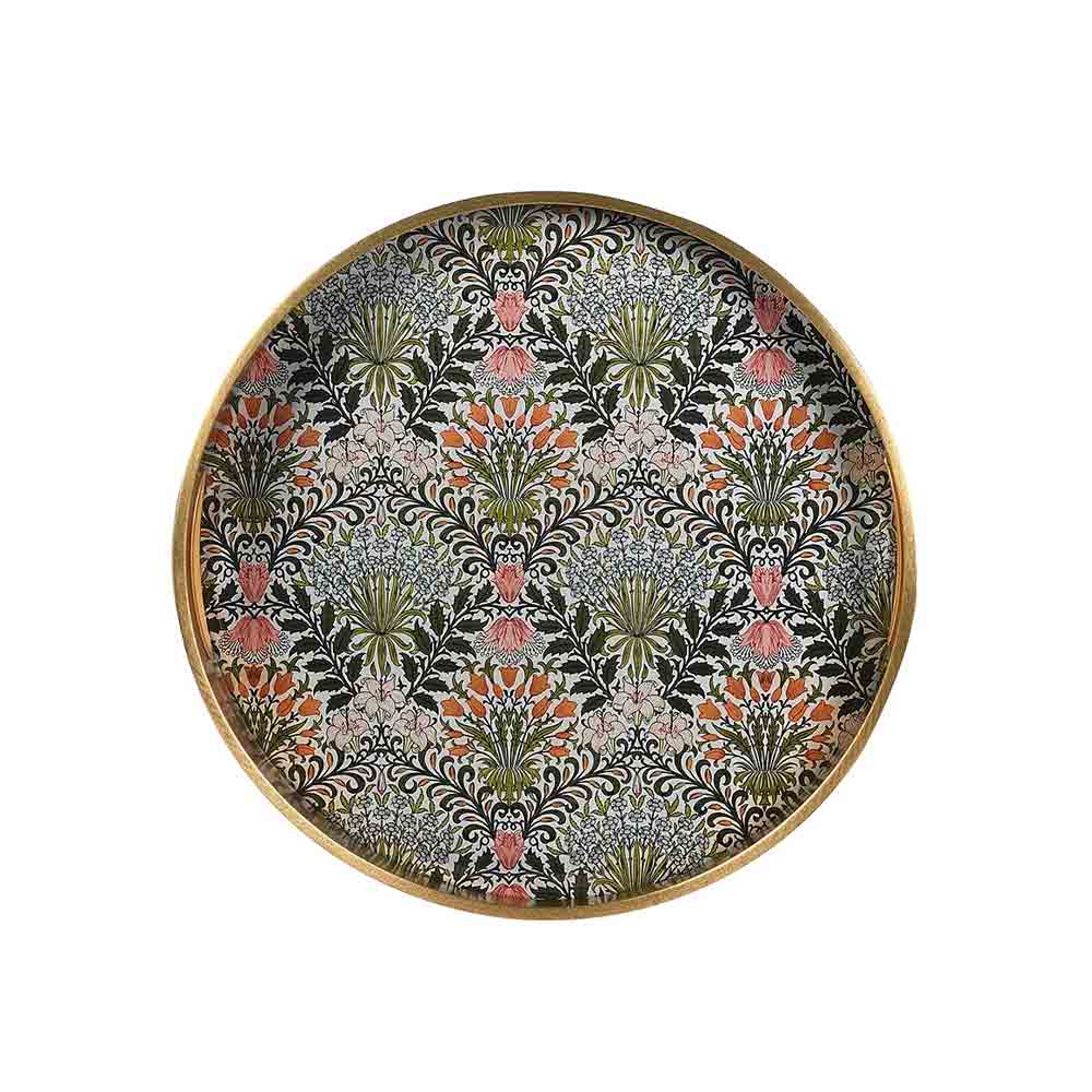 A round decorative tray with a gold-toned rim and a dense floral pattern featuring black, green, pink, and orange motifs on a light background.
