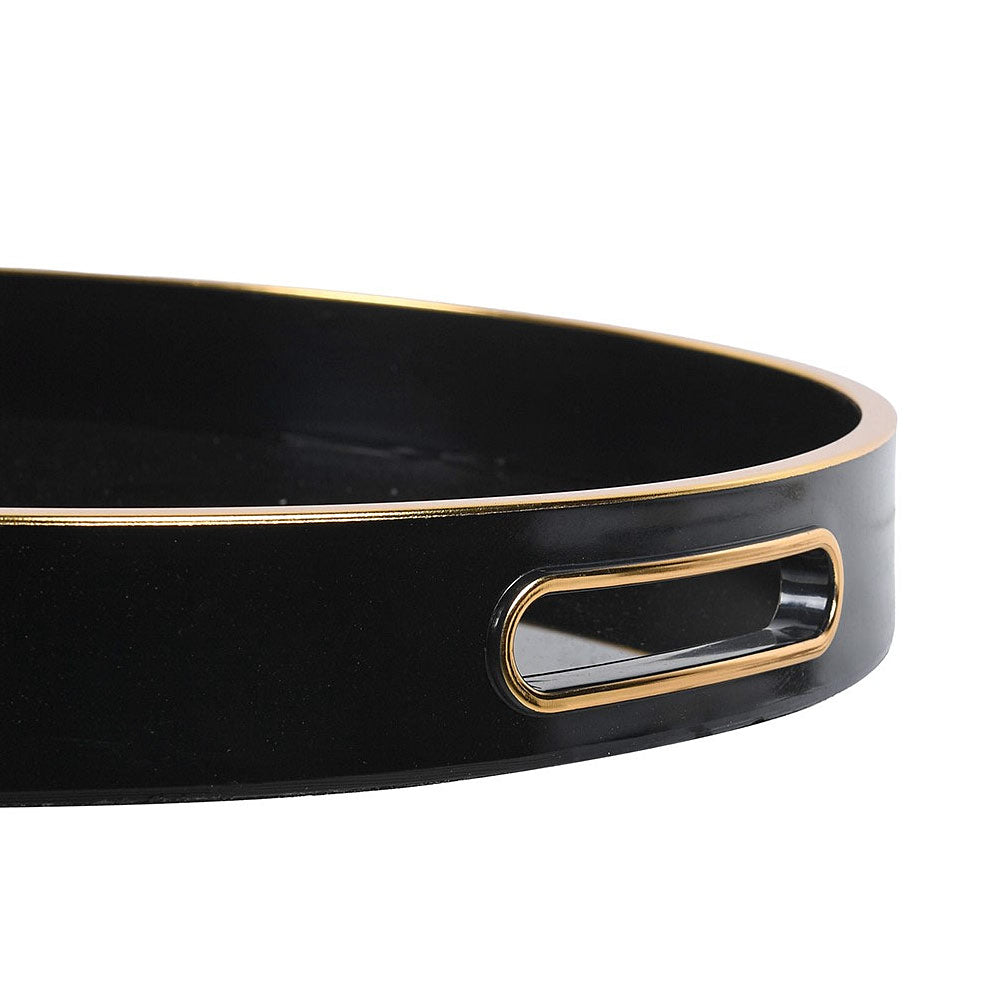 Close-up of a glossy black tray with a gold metal rim and a matching gold handle on a white background.