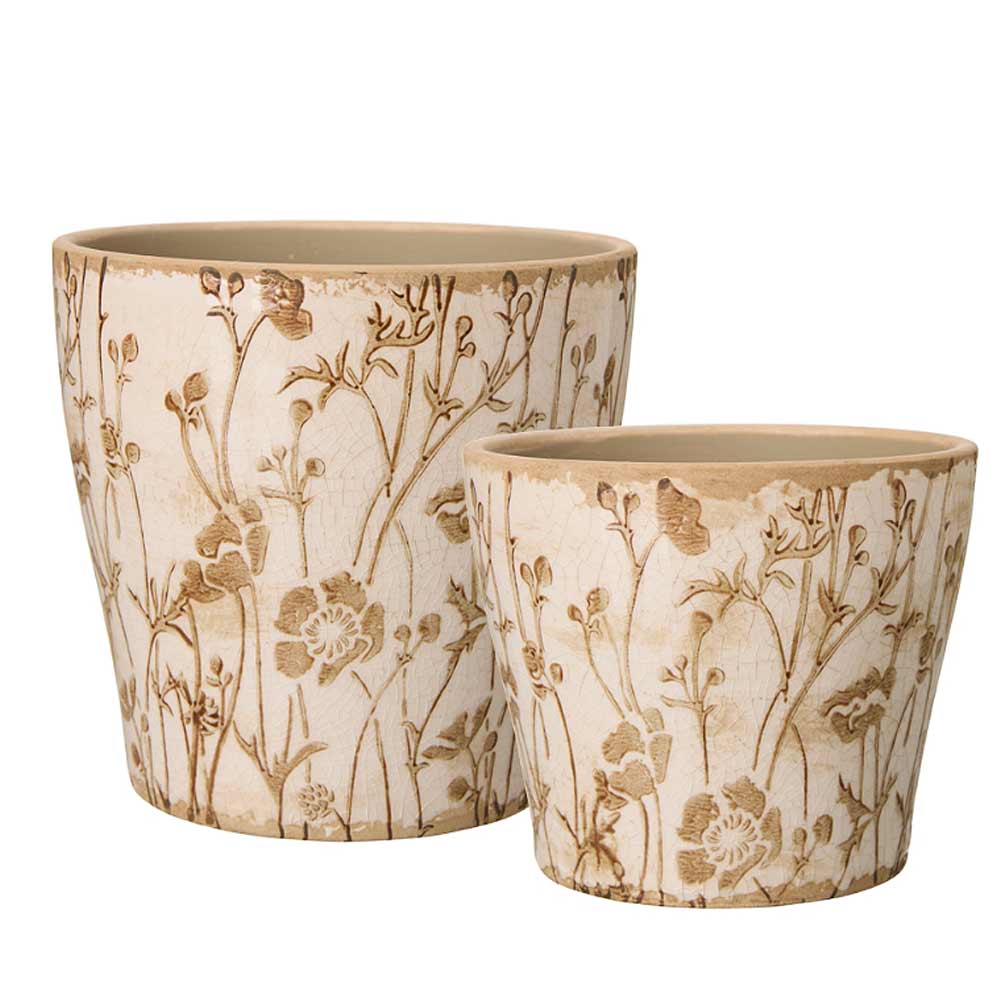 Two ceramic planters in different sizes, featuring a textured cream body with a brown floral and botanical pattern, set against a plain white background.