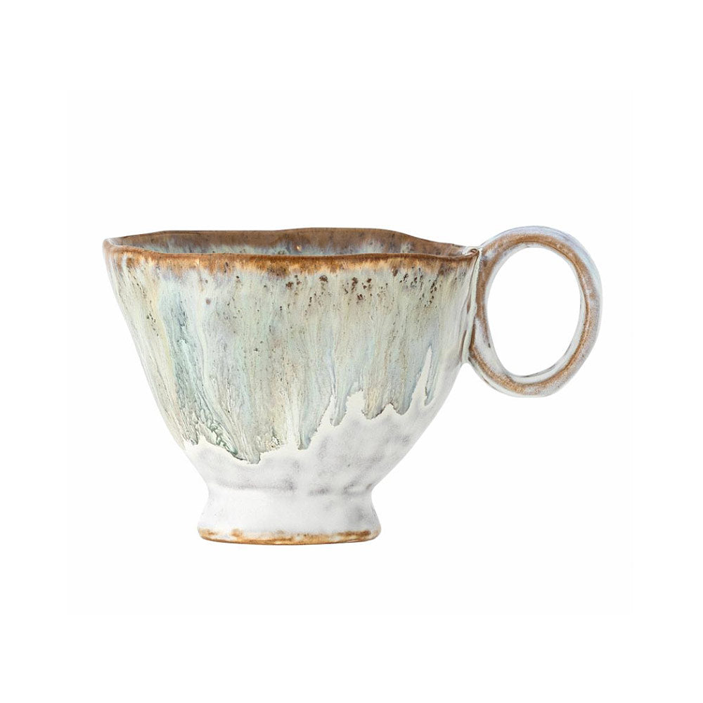 Handmade Imogen cup with grey-green reactive glaze on a white background