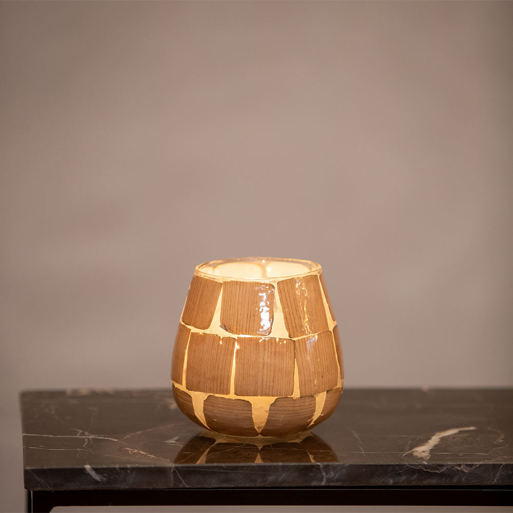 Small Kuala Glass votives on a marble surface with a neutral grey background