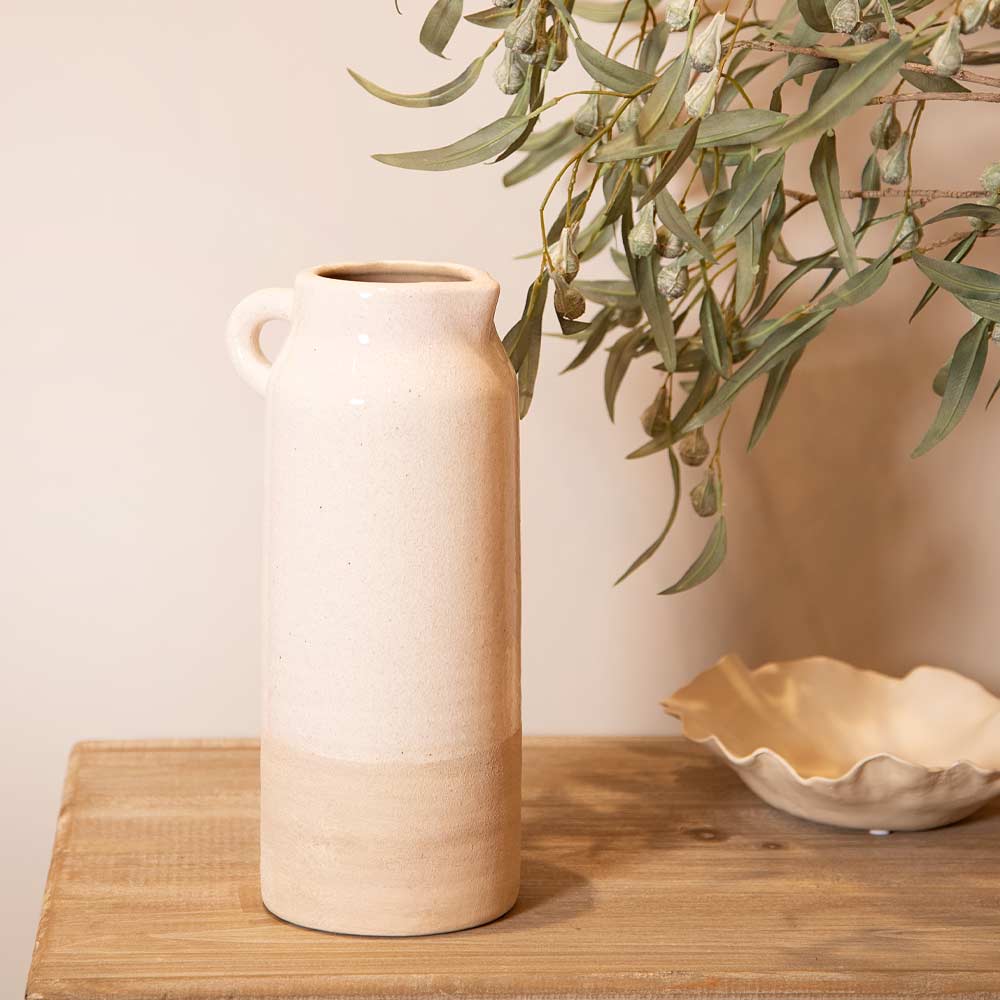 Ceramic Liberec Natural Two Tone Tall Jug and bowl on a wooden surface with greenery in the background