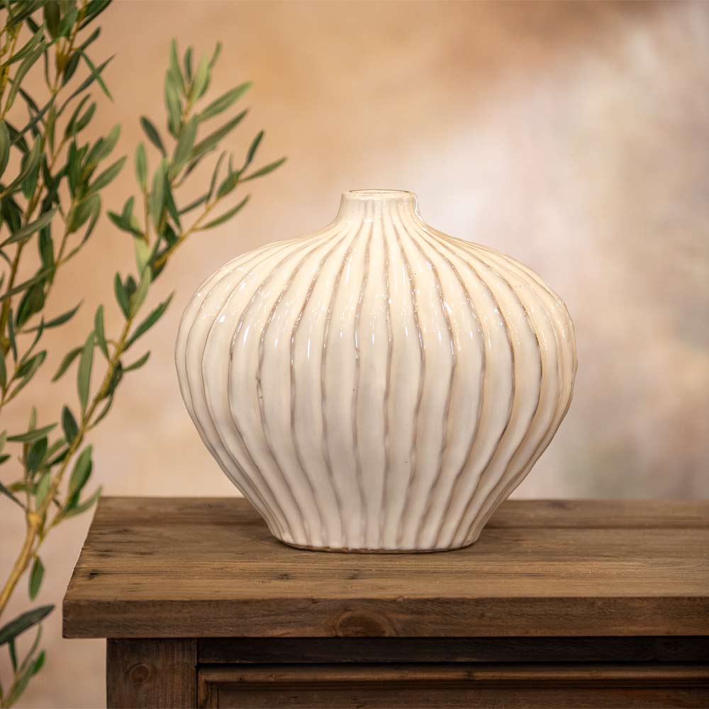 Decorative vase on a wooden table with a blurred background