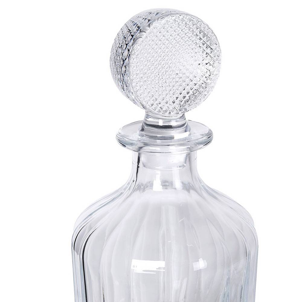 Clear glass Luxe decanter with textured stopper on a white background