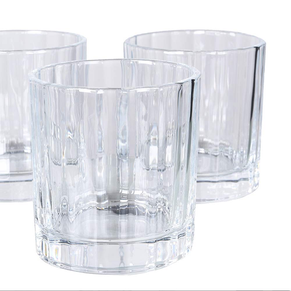 Close up of clear glass tumblers part of Luxe Glass Decanter set - shown on a white background