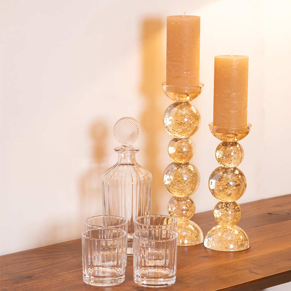 Luxe Glass Decanter Set with four glass tumblers styled on console table with Itinga Candlesticks