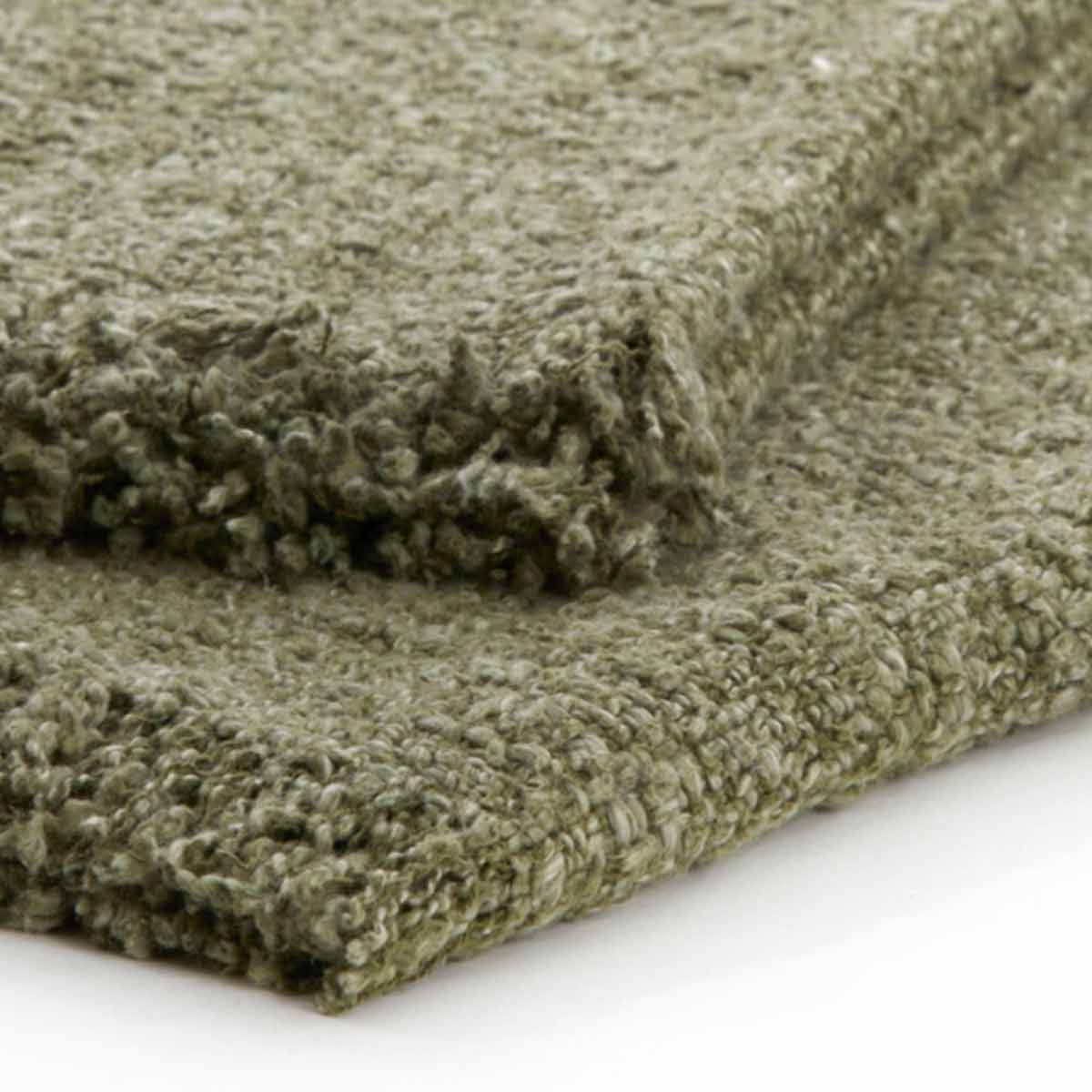 Folded Miraso Cotton Throw in Green close up of boucle textured material