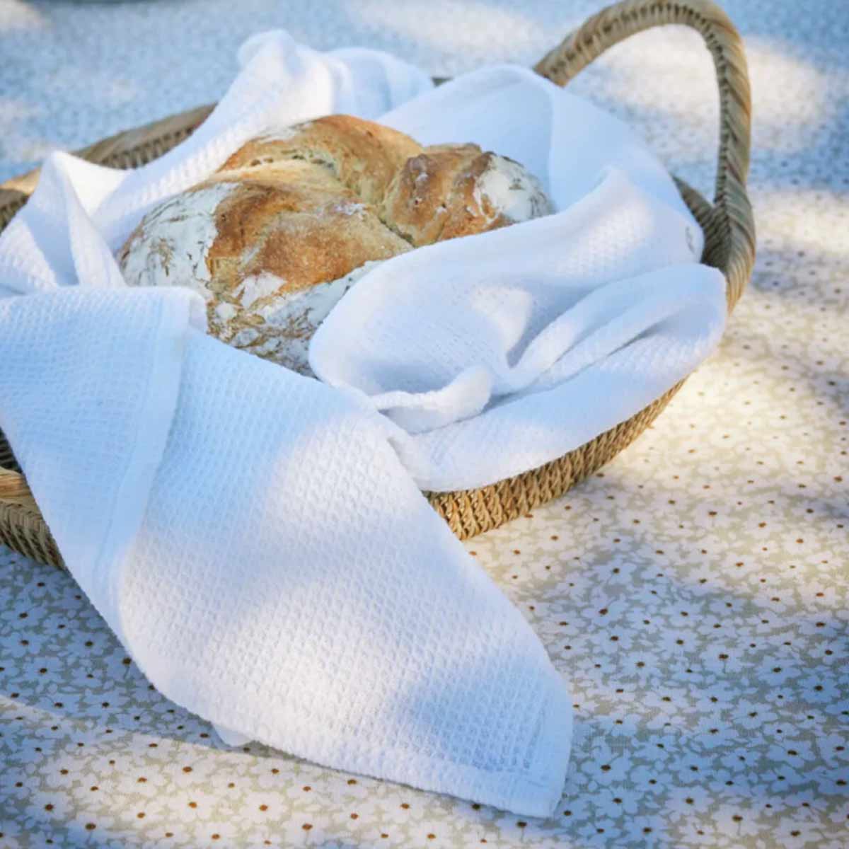 Norah Round Rattan Basket displayed with bread