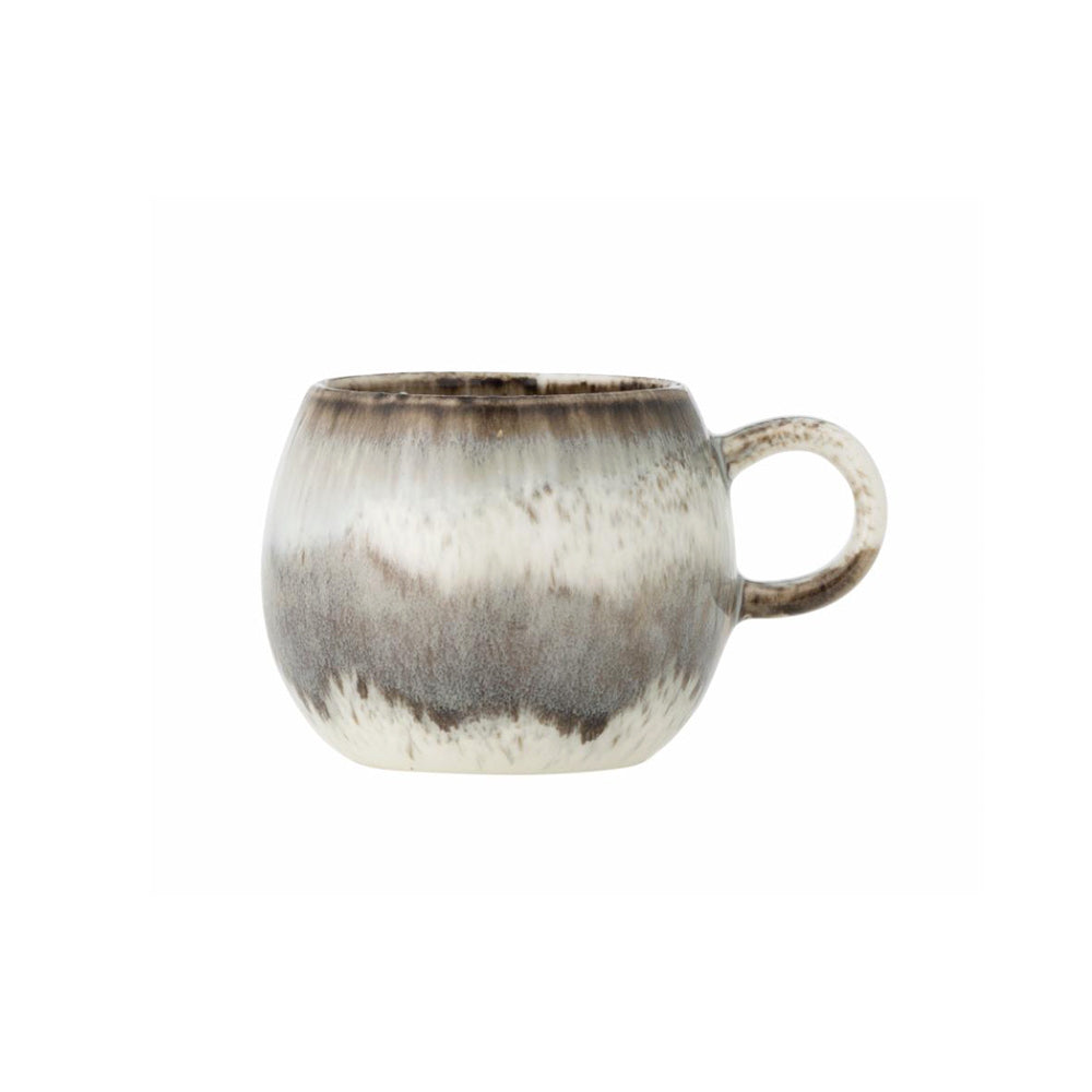 Paula Stoneware Espresso Cup in grey, white, and brown reactive glaze, showcasing its organic circular shape and unique colour variations.