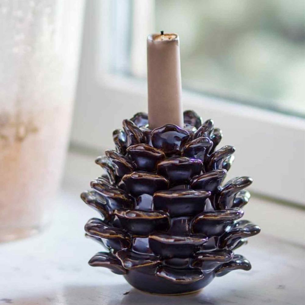 Large Pine Cone Candle Holder - Brown Stoneware - Displated on window with candle