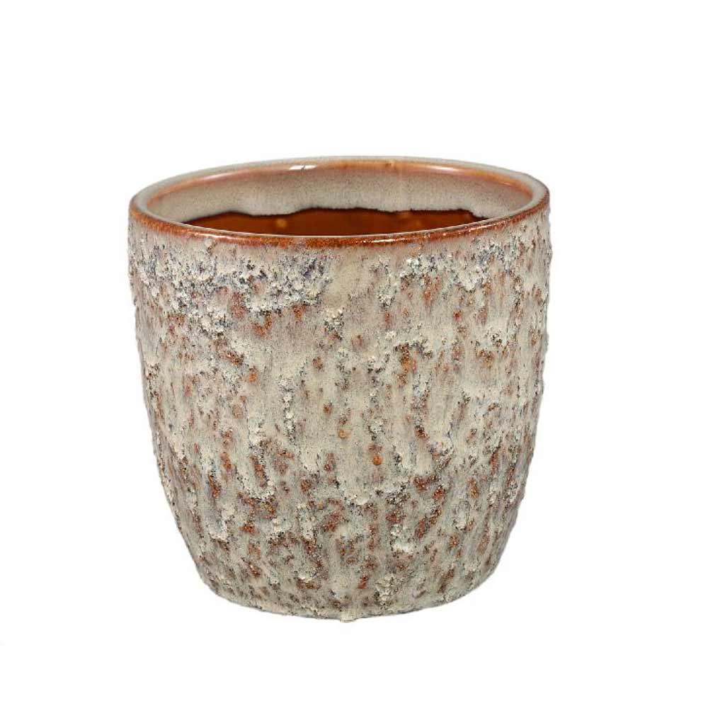 Ceramic pot with textured surface on a white background