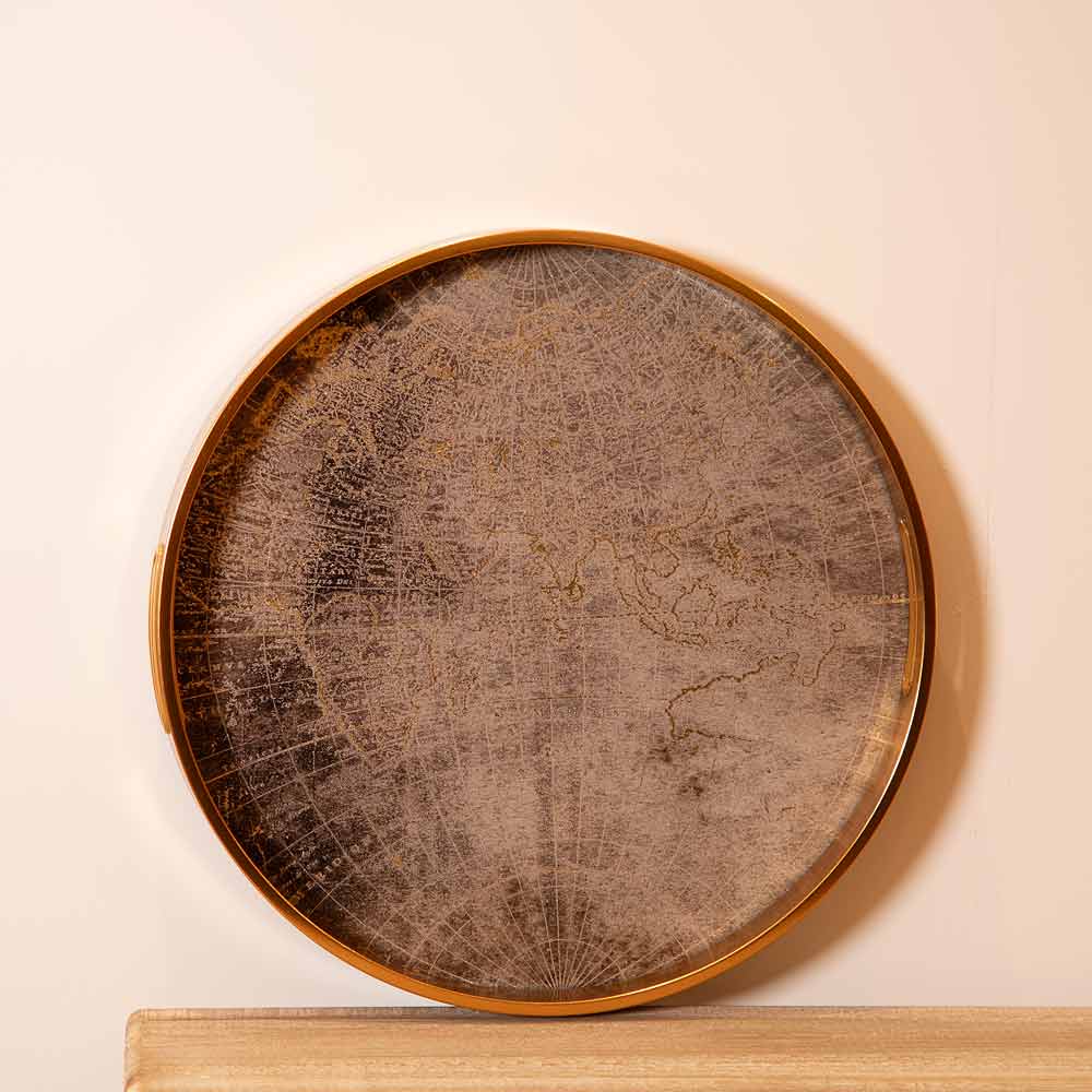 Round World Map Tray leant against a wall on a mantel