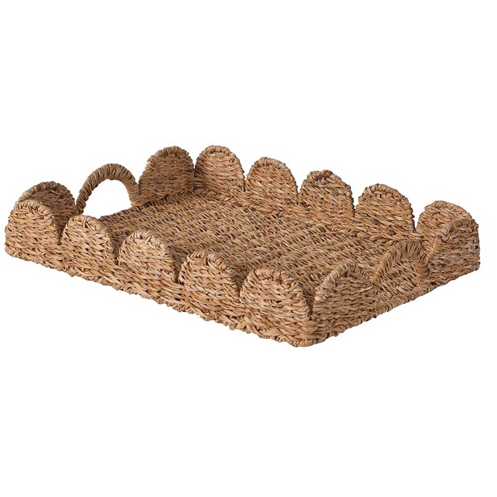 Woven tray with scalloped edge and handles on a white background