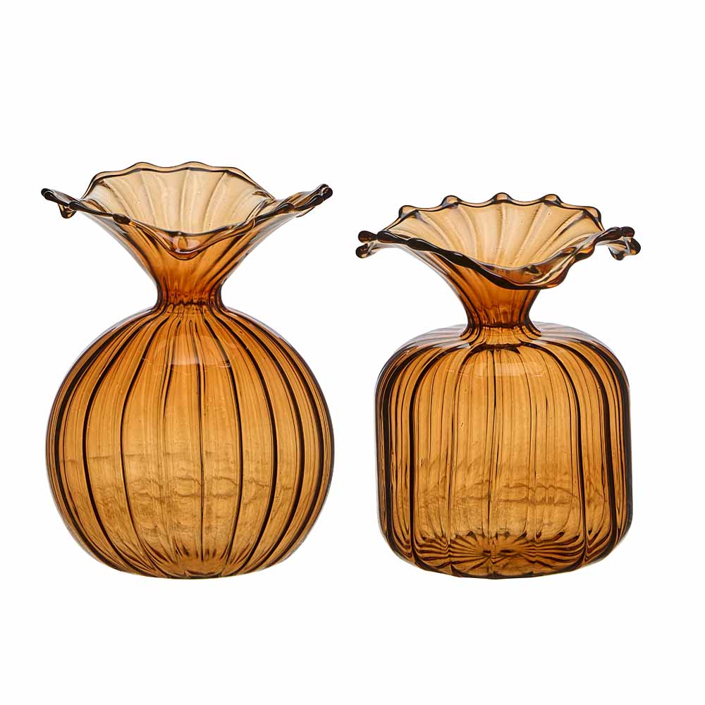 Two amber-colored ribbed glass bud vases with flared scalloped rims, shown on a plain white background.