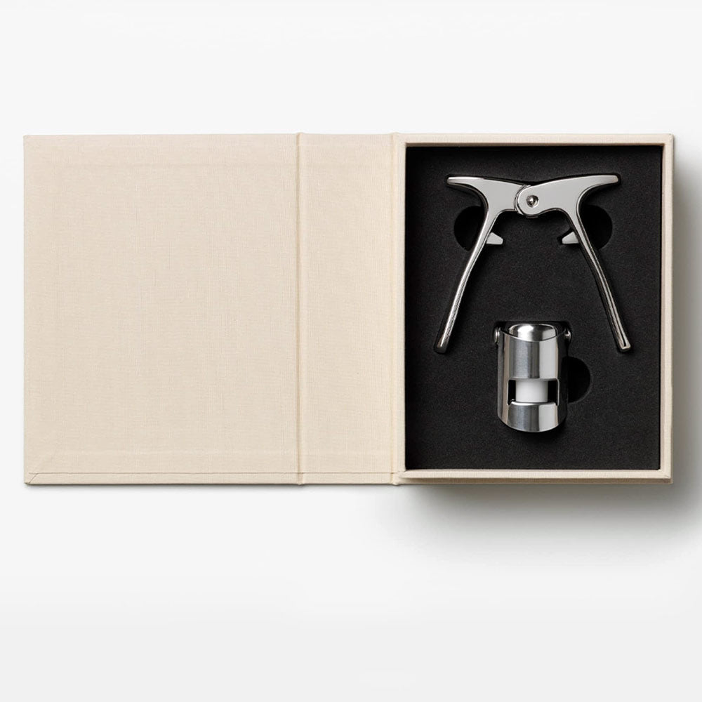 Metallic wine bottle stopper and cork in a gift box - The Essentials - Champagne Tools Gift Set on a white background on a white background