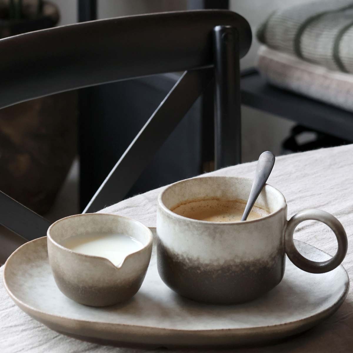 Valence porcelain mug in walnut glaze with coffee on rustic table