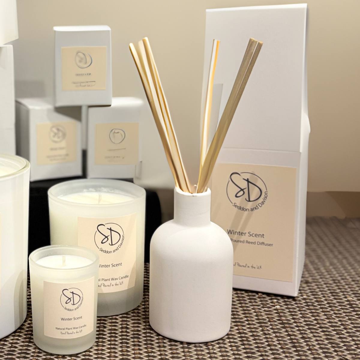Winter Scent, Reed Diffuser in Ceramic Bottle pictures with box on console with candles