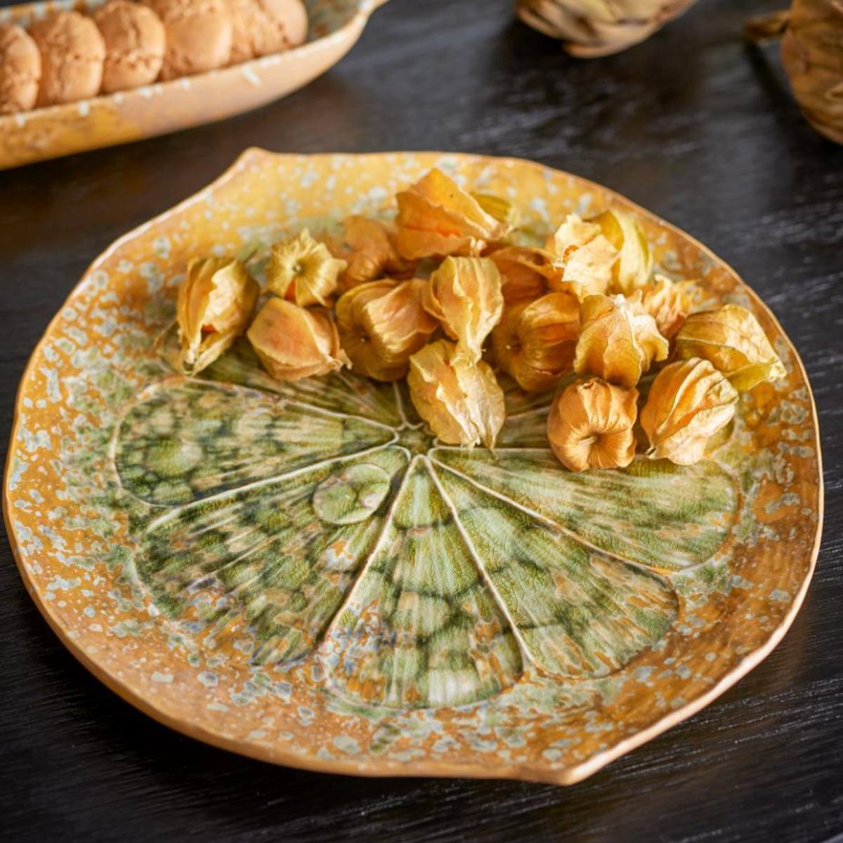 Milani stoneware serving dish with citrus-inspired green glaze – top view with food